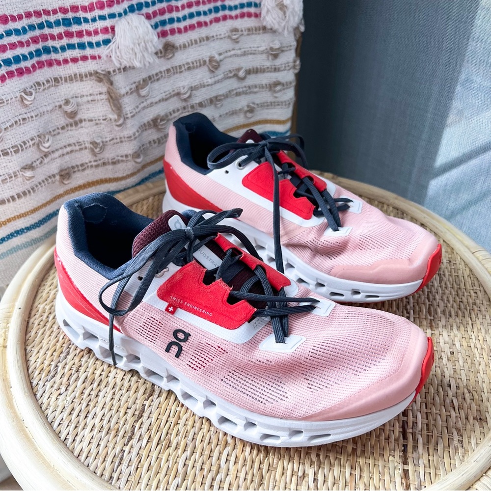 On Running Pink and Red Athletic Shoes